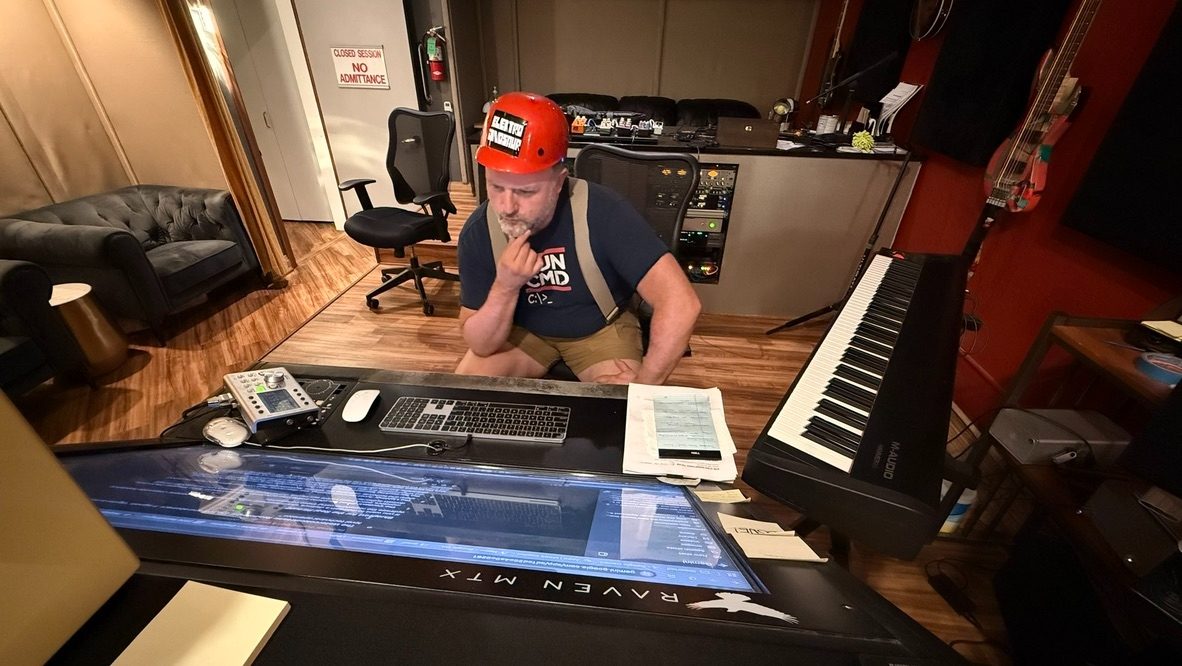 Justin DiCenzo working at the Raven MTX console during a production session at Clayton Studios
